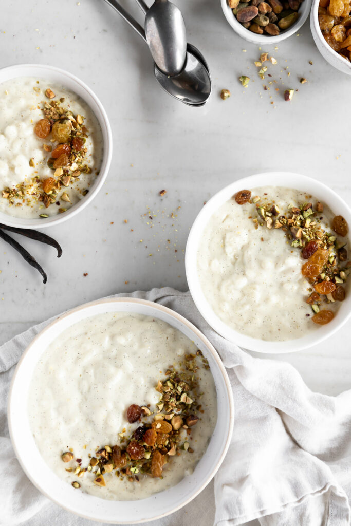 cardamom rice pudding with vanilla bean, golden raisins and pistachios