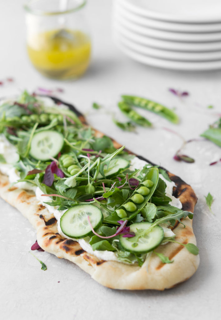 grilled flatbread with ricotta, arugula and peas