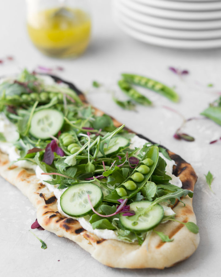 grilled flatbread with ricotta, arugula and peas