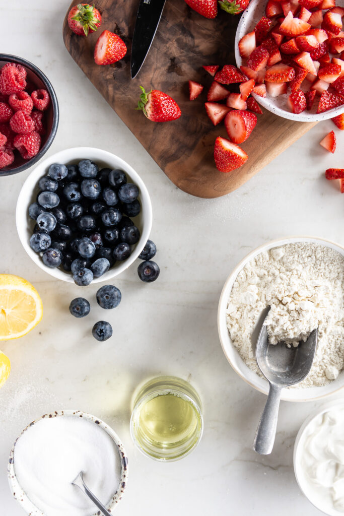 strawberries, blueberries, raspberries, creme fraiche, lemons