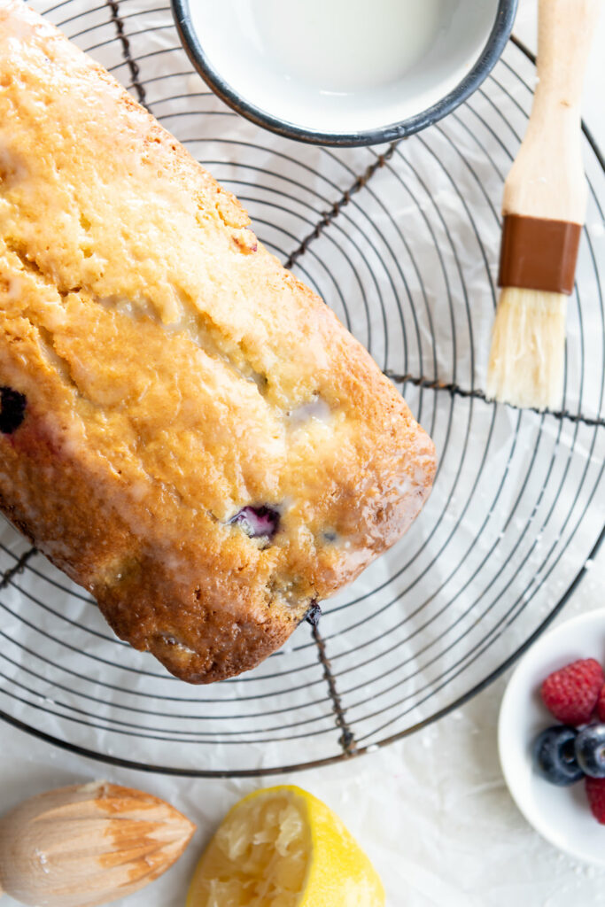 triple berry cake with lemon glaze