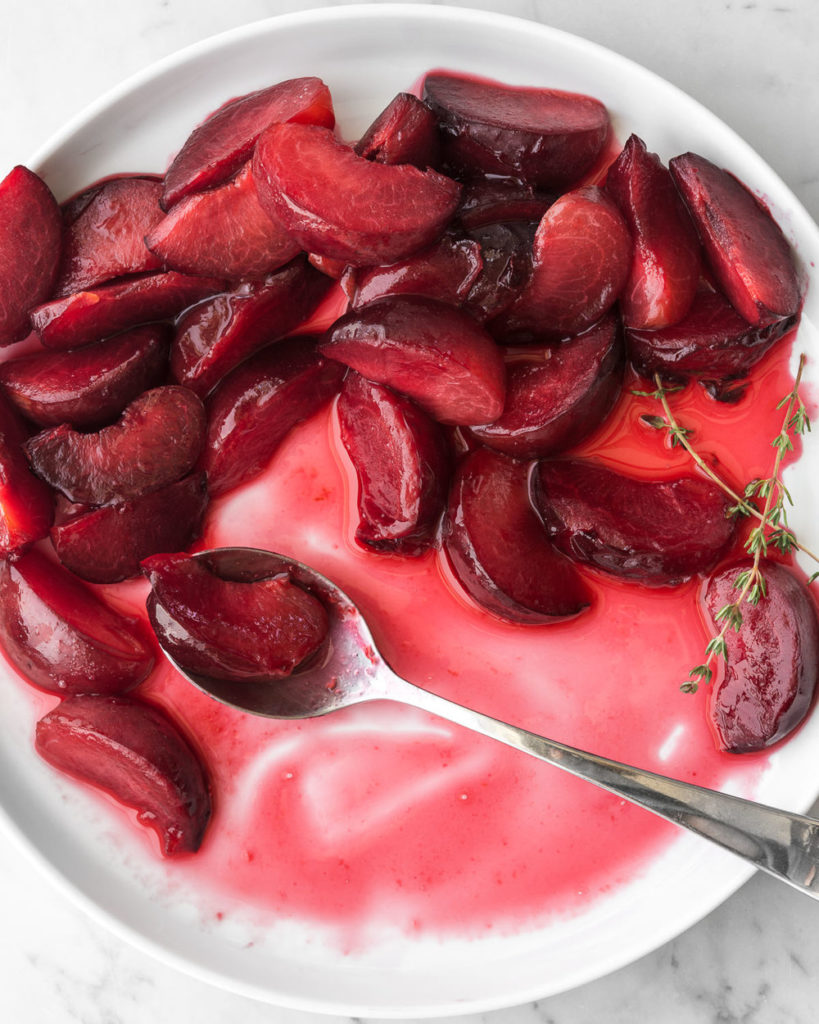 poached summer plums in honey thyme syrup