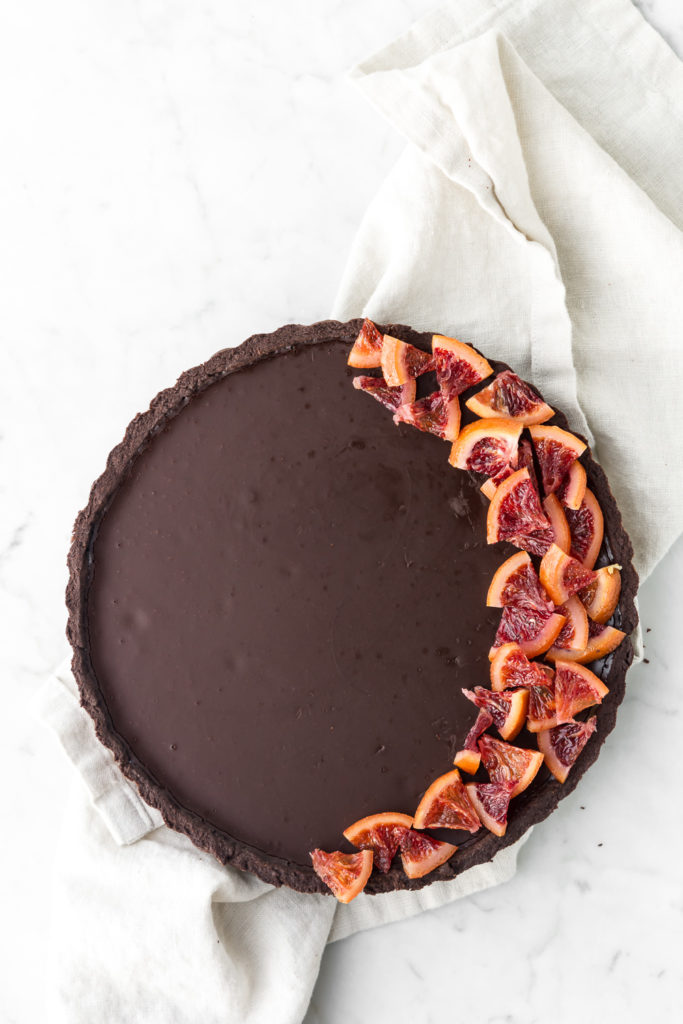 rich bitterwseet chocolate tart with candied blood oranges