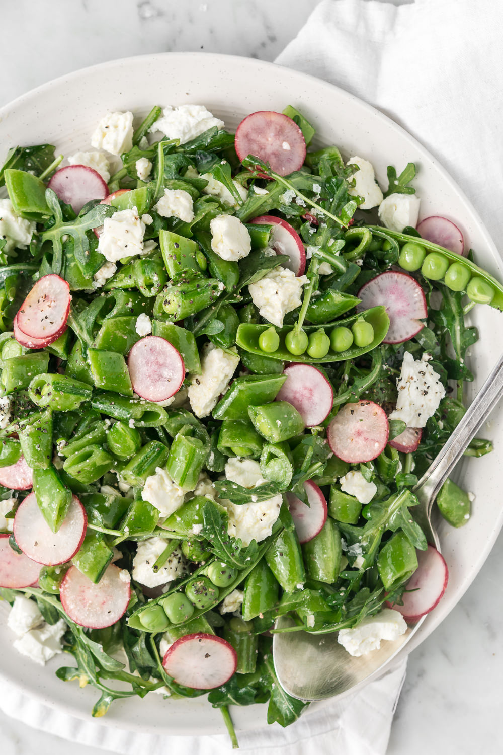 sugar snap pea salad with radishes, feta and arugula - With Spice