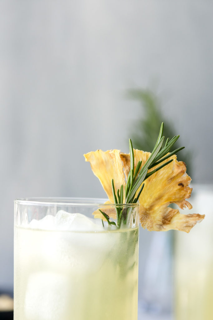 pineapple rum cocktail with dried pineapple flowers