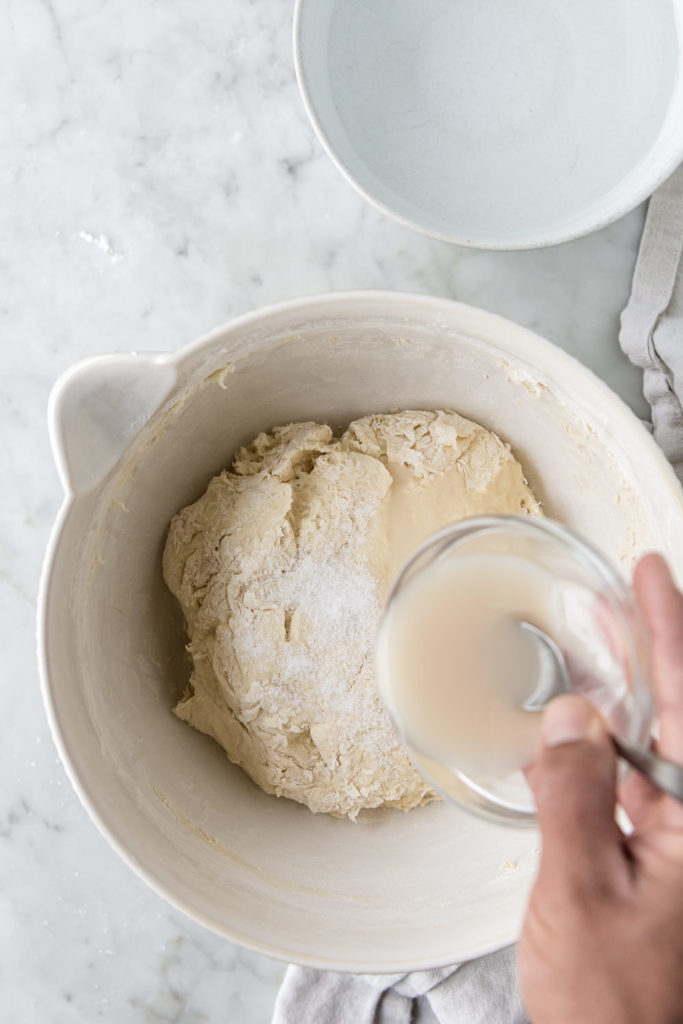 adding yeast to dough