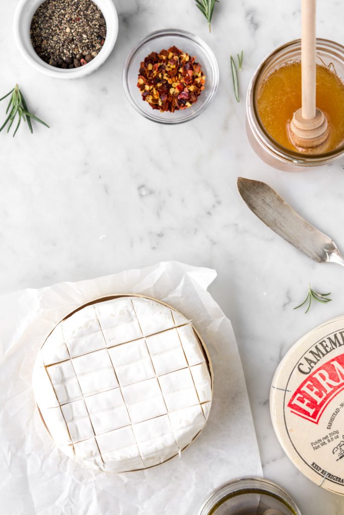 crosshatch scored camembert with honey, red pepper flakes and black pepper