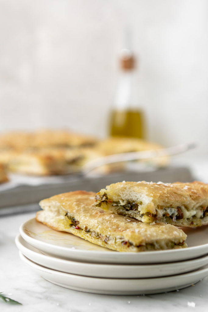 stuffed focaccia with mozzarella cheese and pistachio parsley pesto