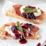 burrata crostini with crispy prosciutto, blackberry honey sauce and fried sage