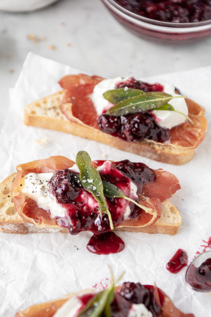 burrata toast with crispy prosciutto, blackberry honey sauce and fried sage