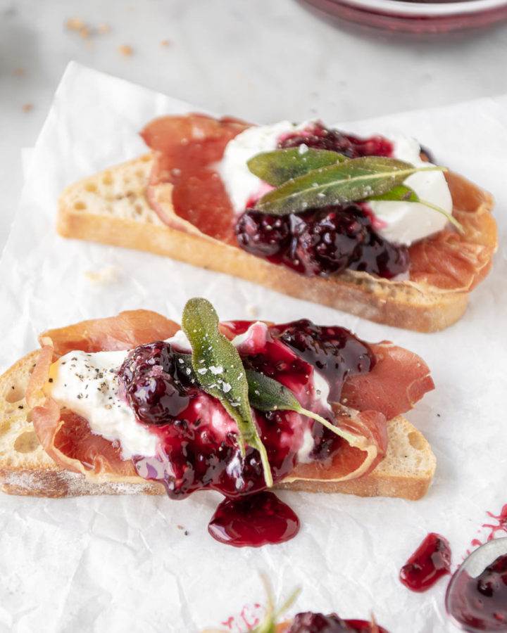 burrata crostini with crispy prosciutto, blackberry honey sauce and fried sage