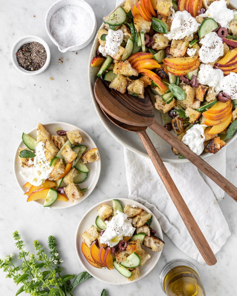 grilled panzanella salad with peaches, cucumber, olives, burrata and herbs