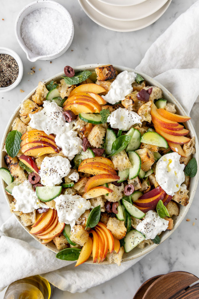 grilled peach panzanella salad with cucumber, olives and burrata