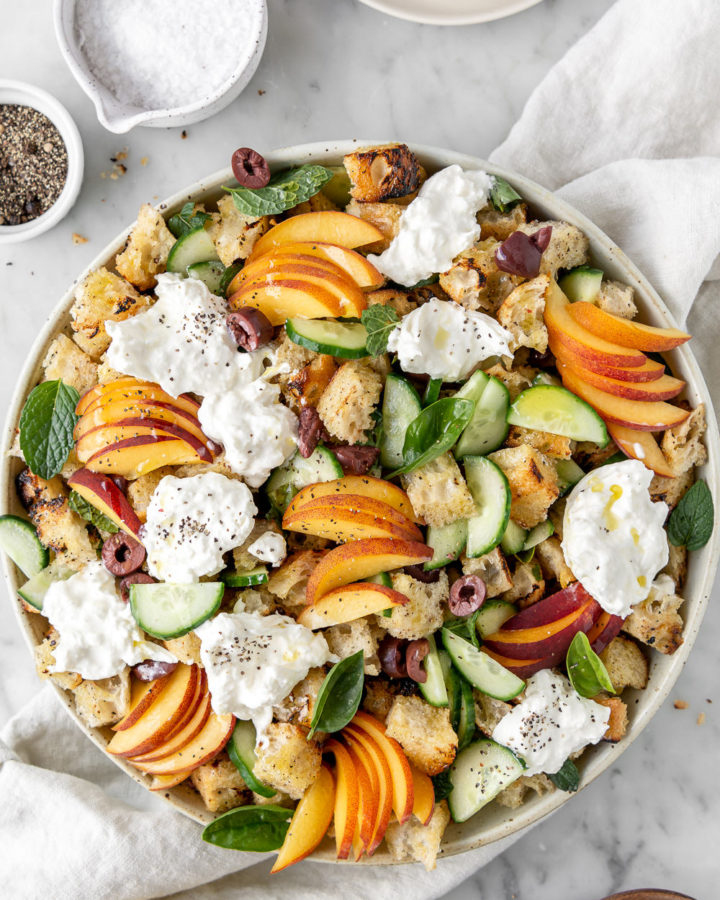 grilled peach panzanella salad with cucumber, olives and burrata