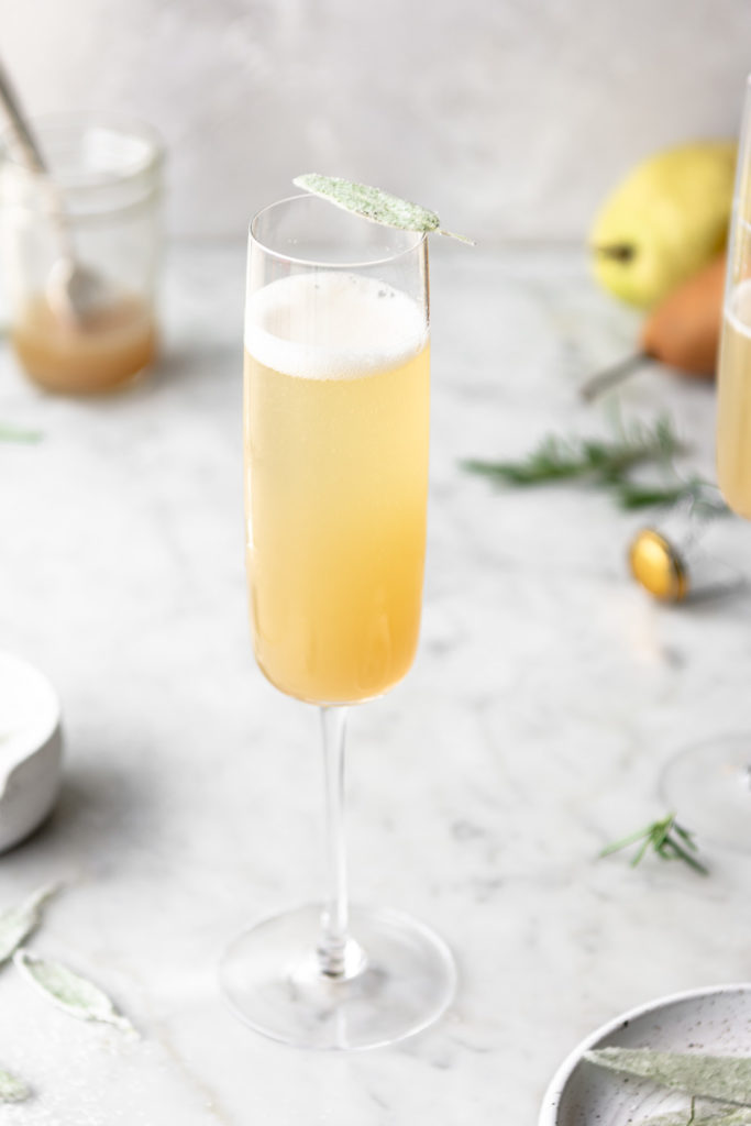 honey pear bellini with candied sage leaves