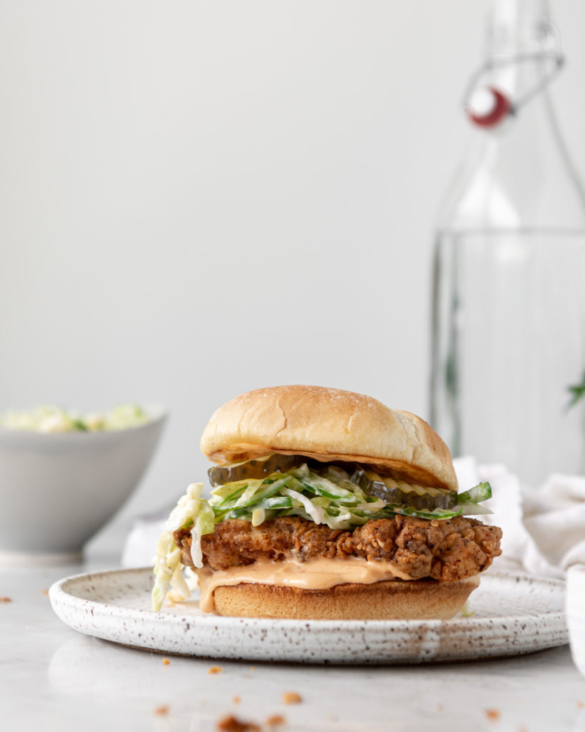 spicy fried chicken sandwich with sriracha mayo and jalapeno slaw