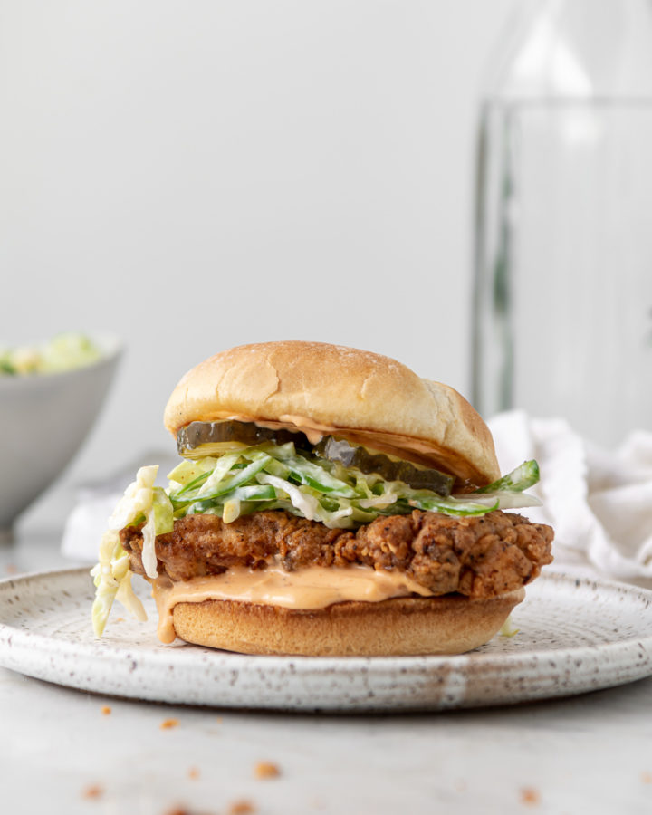 spicy fried chicken sandwich with sriracha mayonnaise and jalapeno slaw