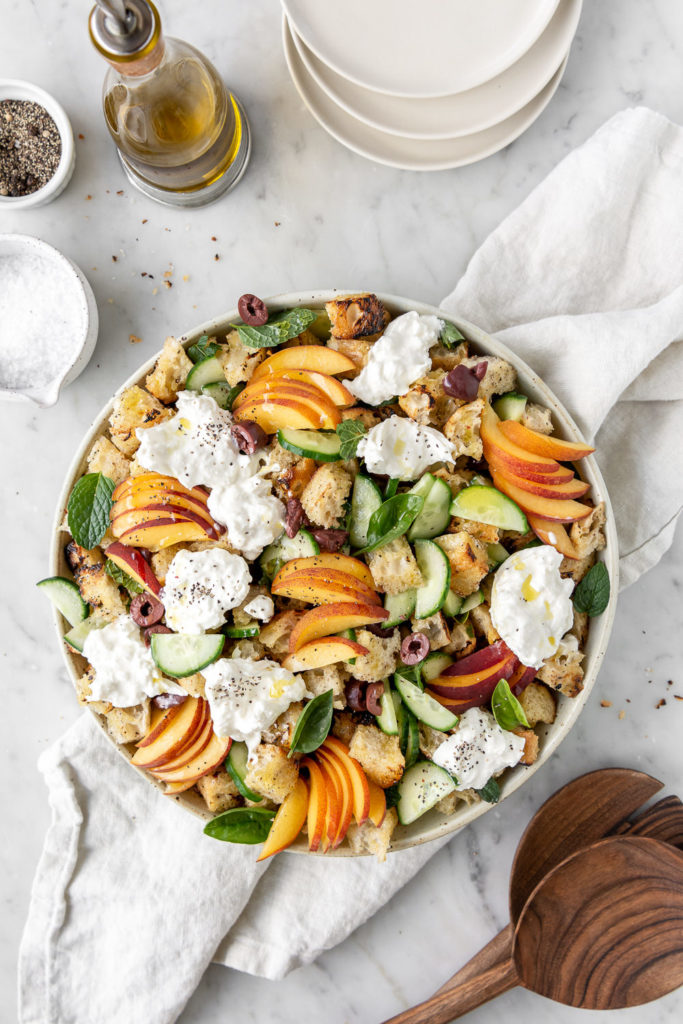 summer panzanella salad wtih peaches, burrata and cucumbers