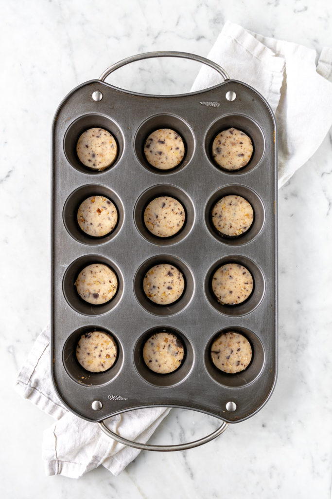 walnut shortbread cookie dough circles in muffin pan
