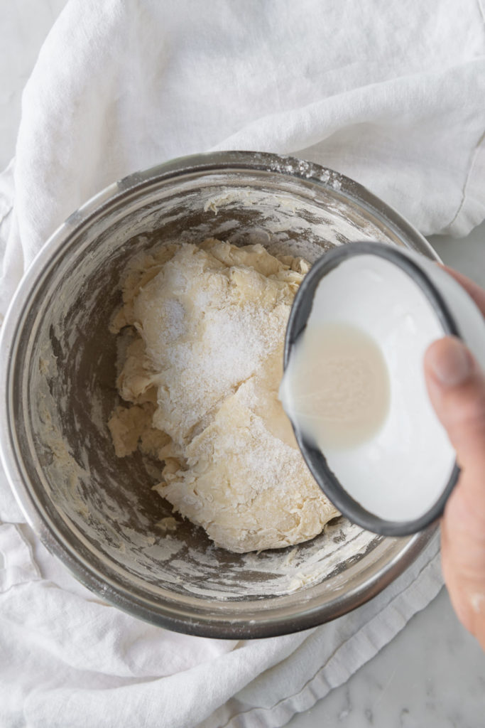 adding yeast to dough