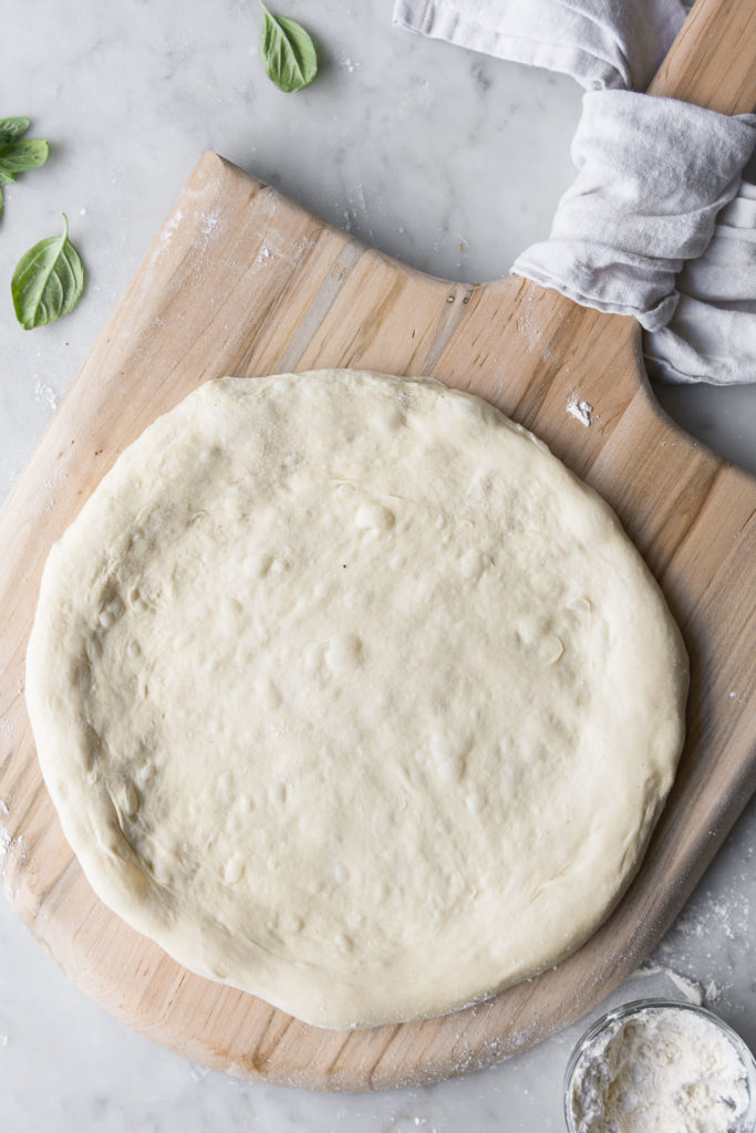artisan pizza dough ready for toppings