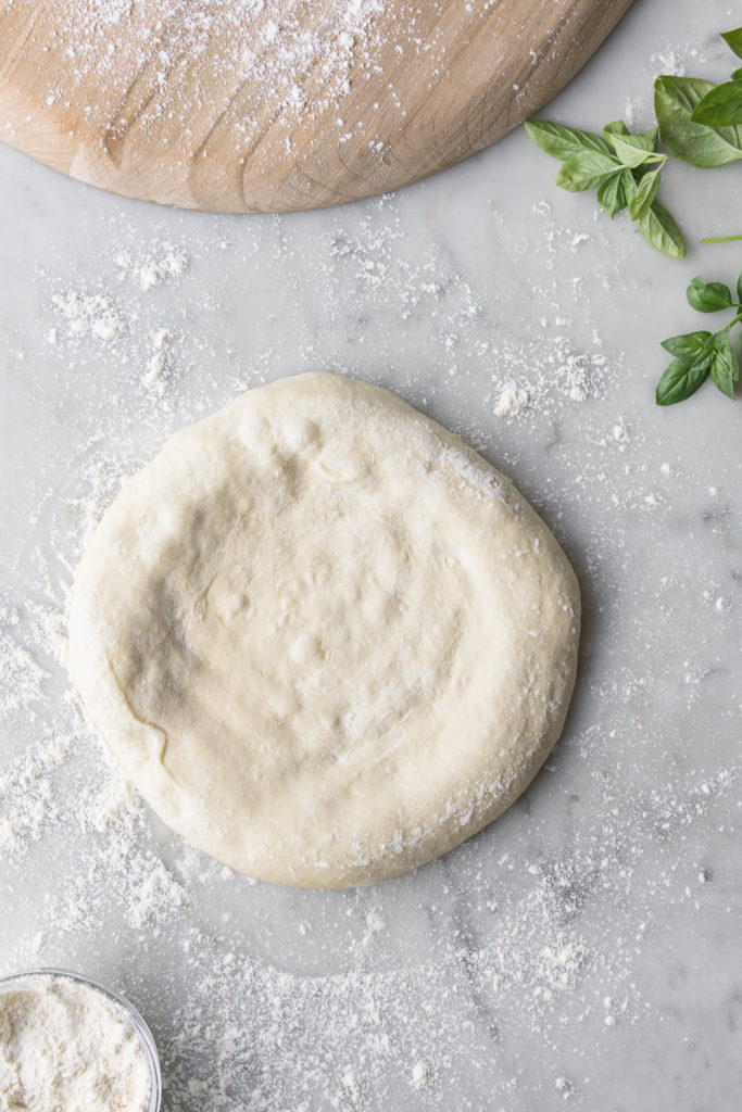 shaping artisan pizza dough