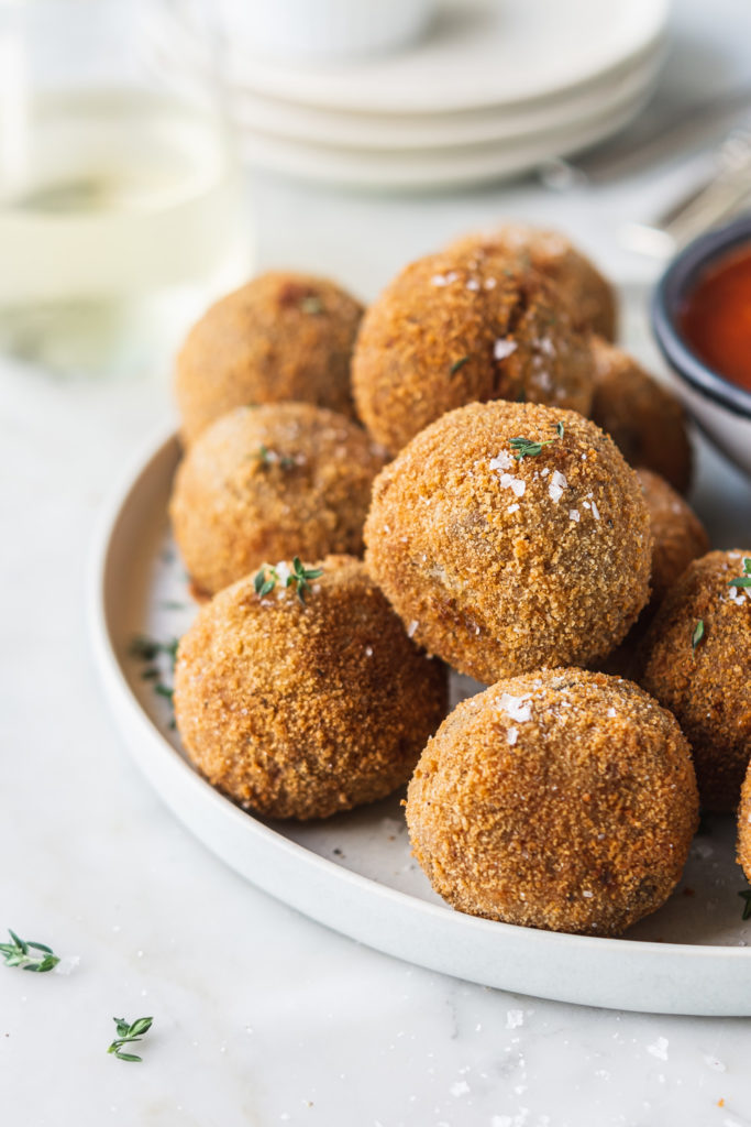 fried porcini risotto arancini with truffle oil and marinara sauce