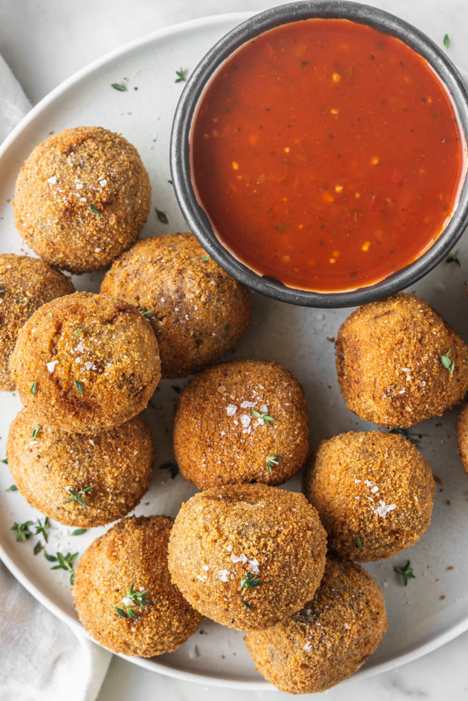 porcini arancini with truffle oil and marinara sauce