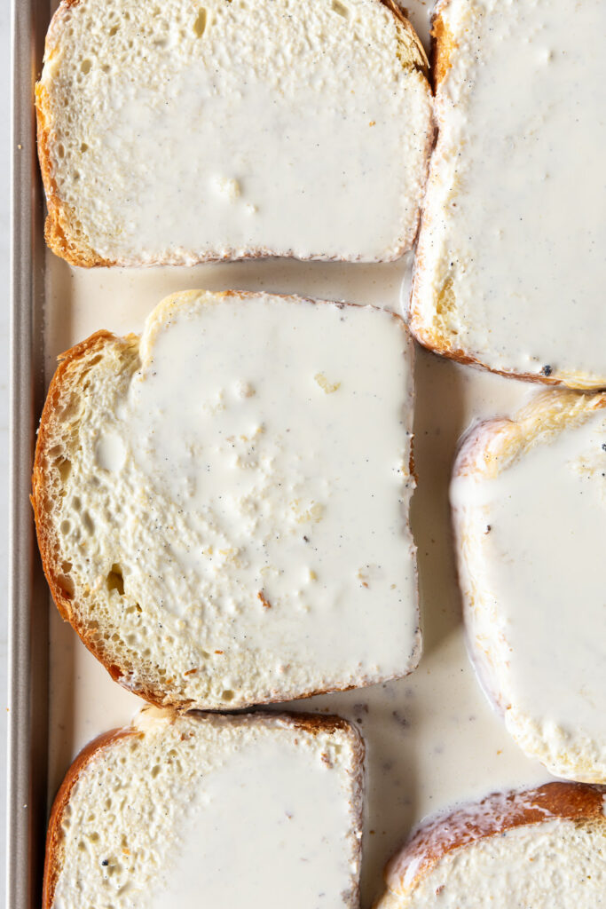 brioche slices soaking in vanilla custard