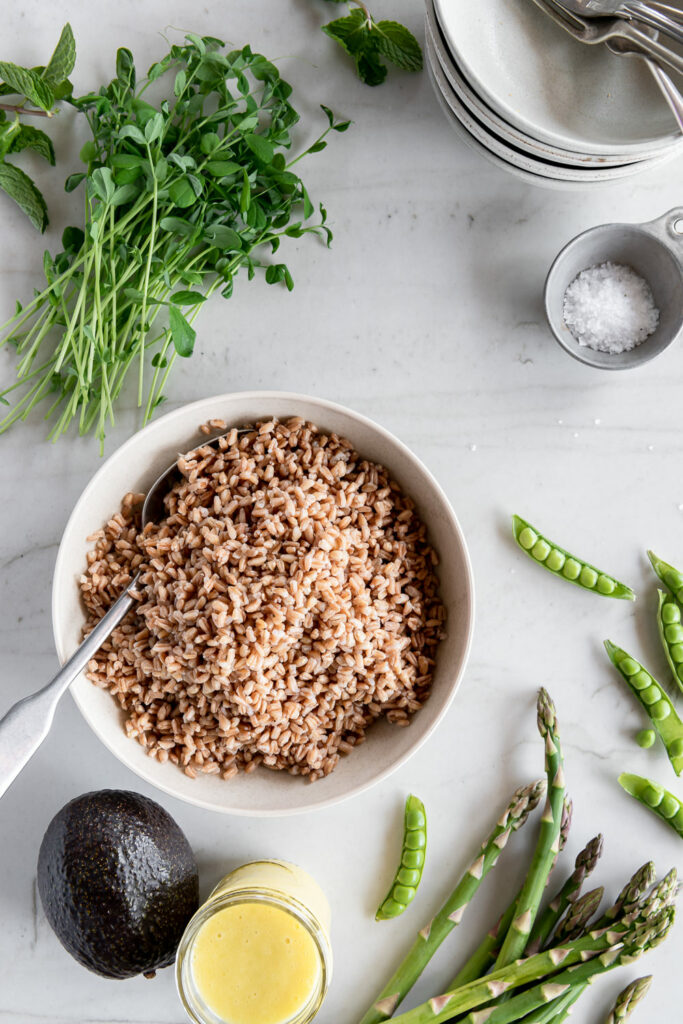 farro, asparagus, peas, pea shoots, avocado, dressing