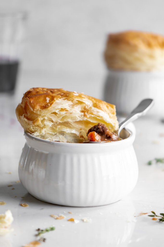 wine braised mushroom beef pie with puff pastry lids