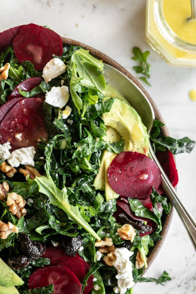 raw beet salad recipe with avocado, olives, goat cheese and walnuts
