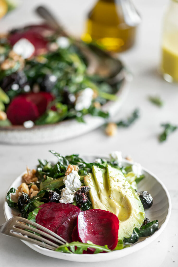 shaved beet salad with avocado, olives, goat cheese and citrus dressing