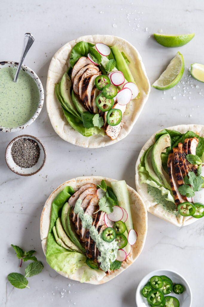 grilled chicken pitas with avocado, cucumber, radishes and lettuce