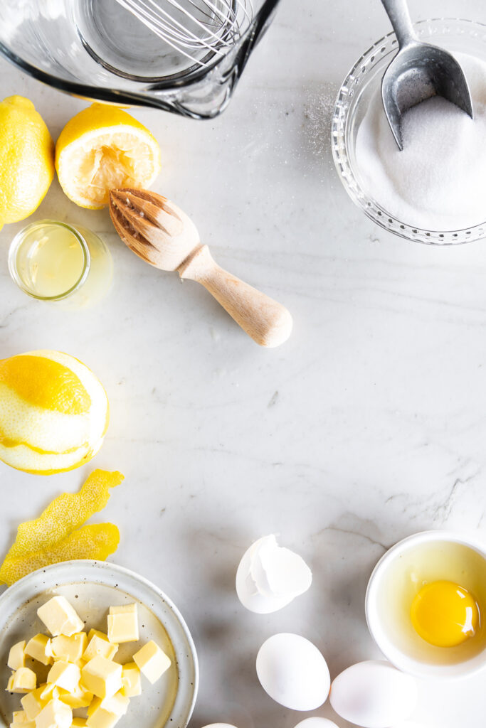 ingredients for lemon curd- lemons, sugar, butter, eggs