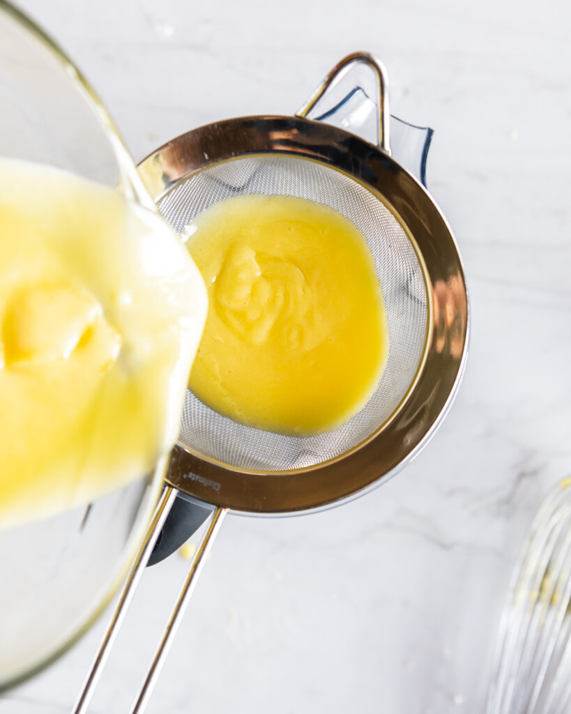 straining lemon curd