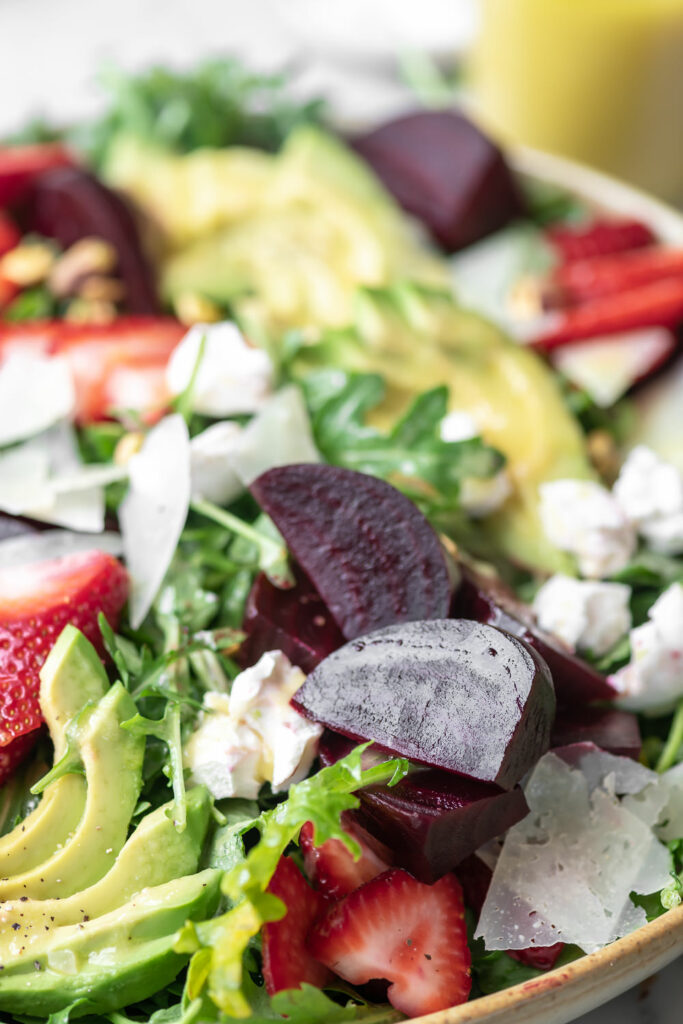 beet goat cheese arugula salad with avocado and strawberries