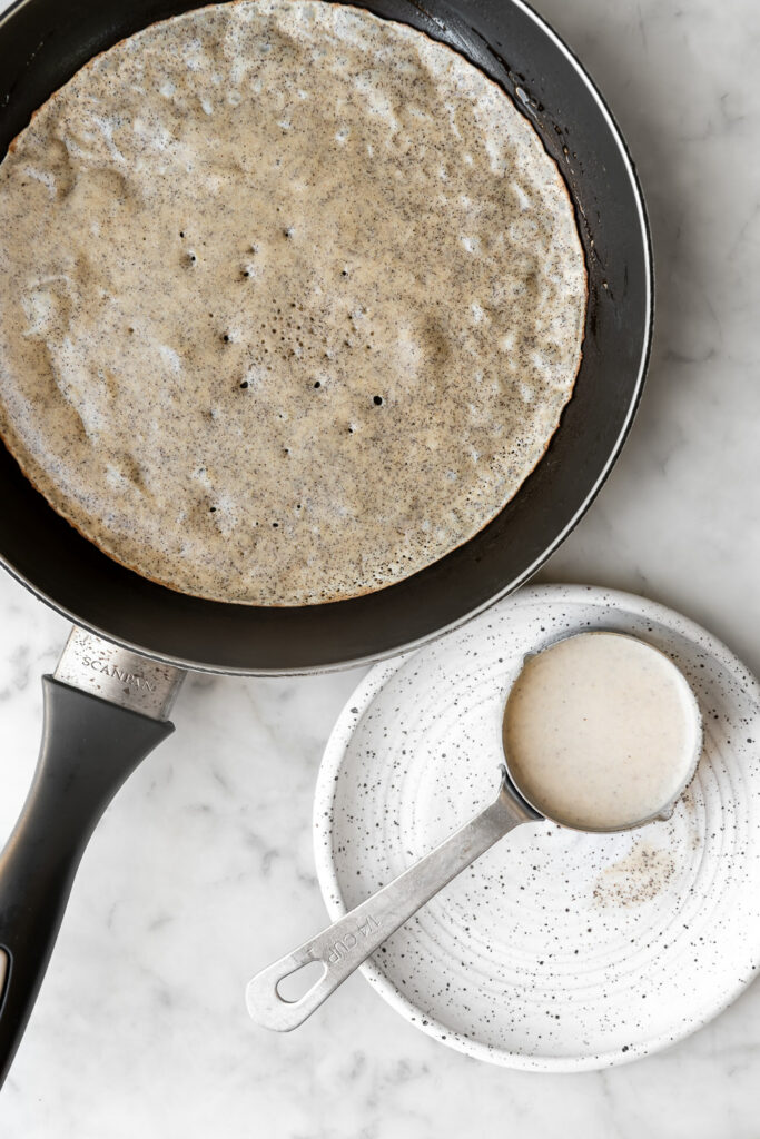 cooking a buckwheat crepe in a non-stick skillet