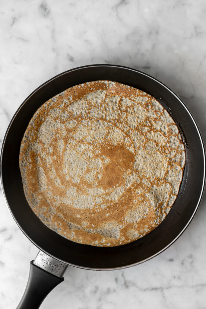 cooking a crepe in a non-stick skillet