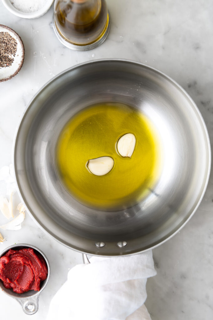 cooking garlic cloves in olive oil