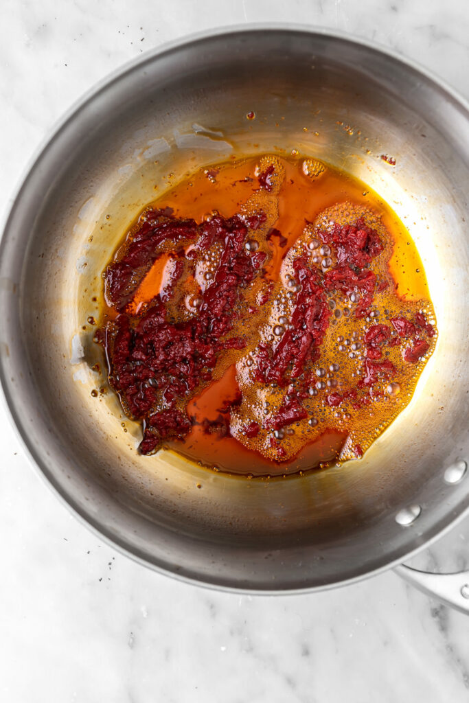 frying tomato paste in olive oil