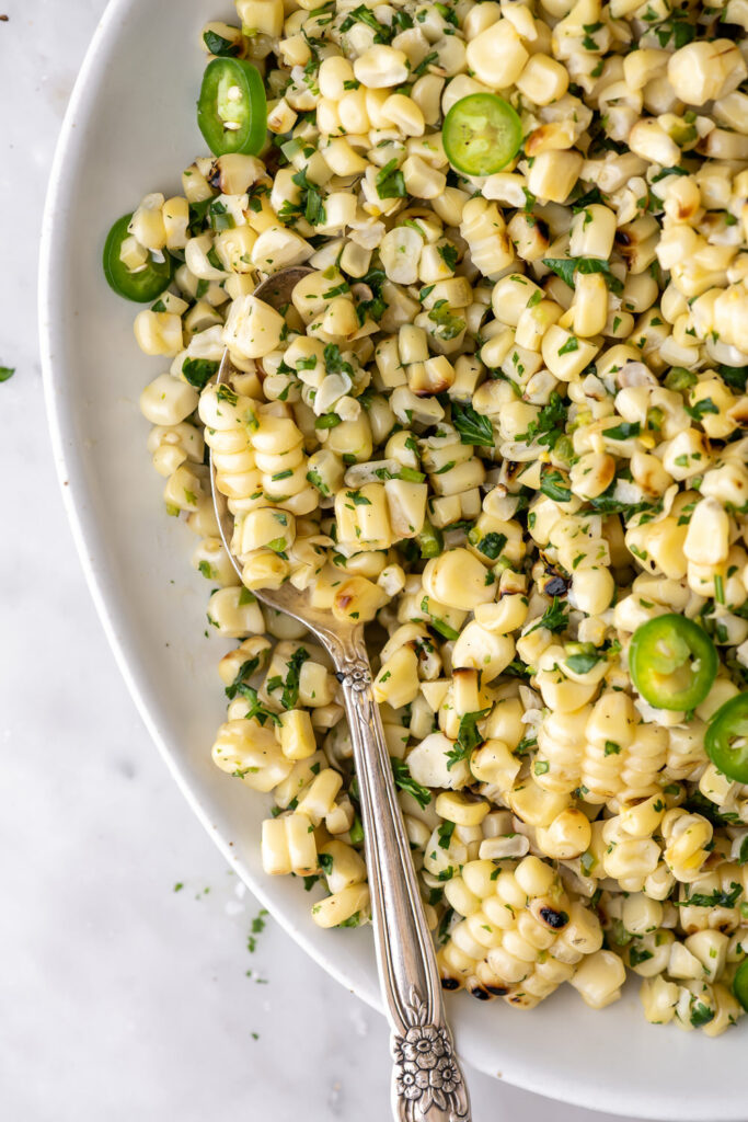 grilled corn salad with serrano peppers and herbs