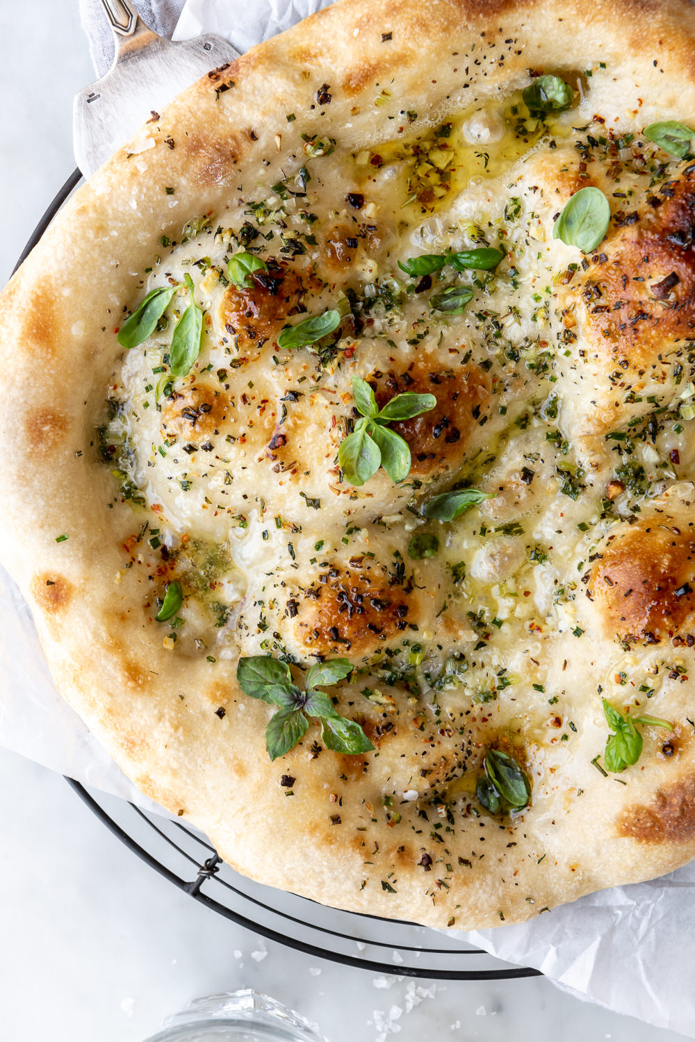 buttery garlic pizza with fresh herbs