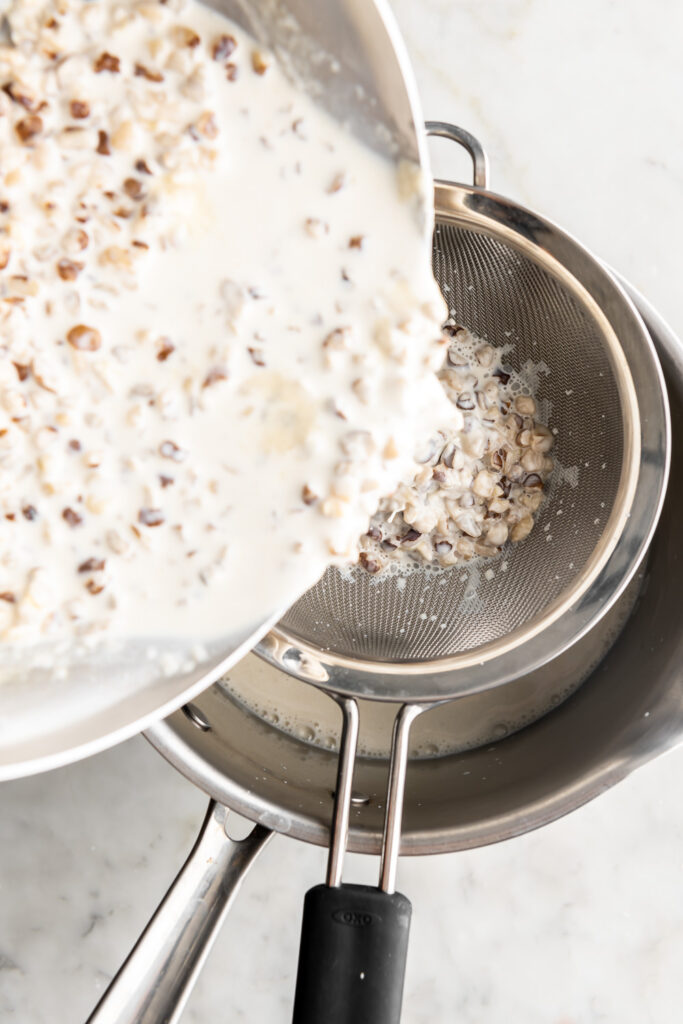 straining walnut infused cream