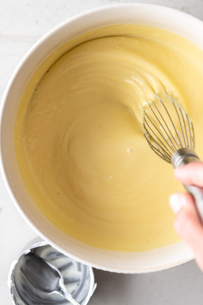 whisking greek yogurt into lavender ice cream base