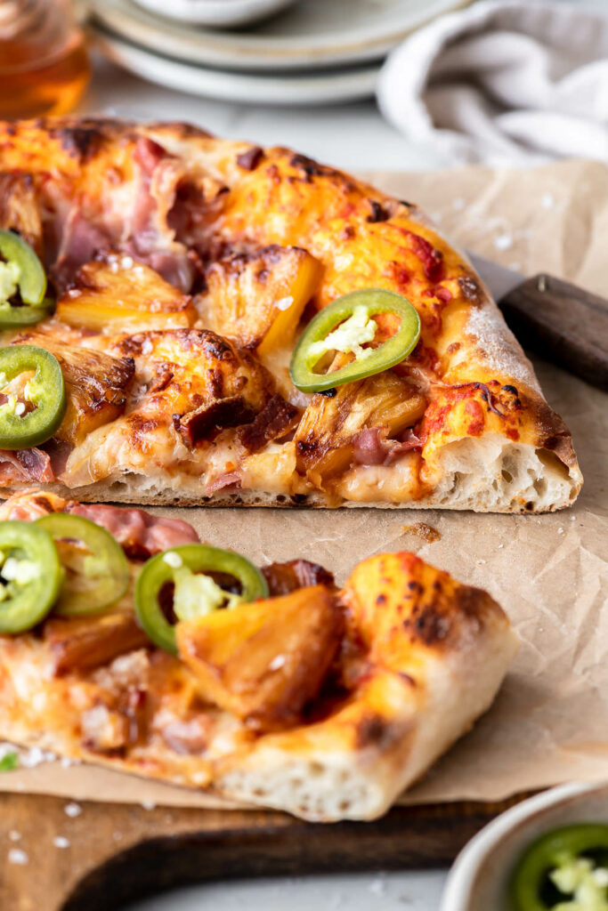 caramelized pineapple pizza with prosciutto, bacon and jalapeño peppers