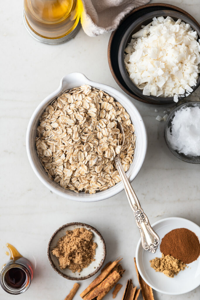 oats, coconut flakes, coconut oil, olive oil, cinnamon, maple syrup, ginger