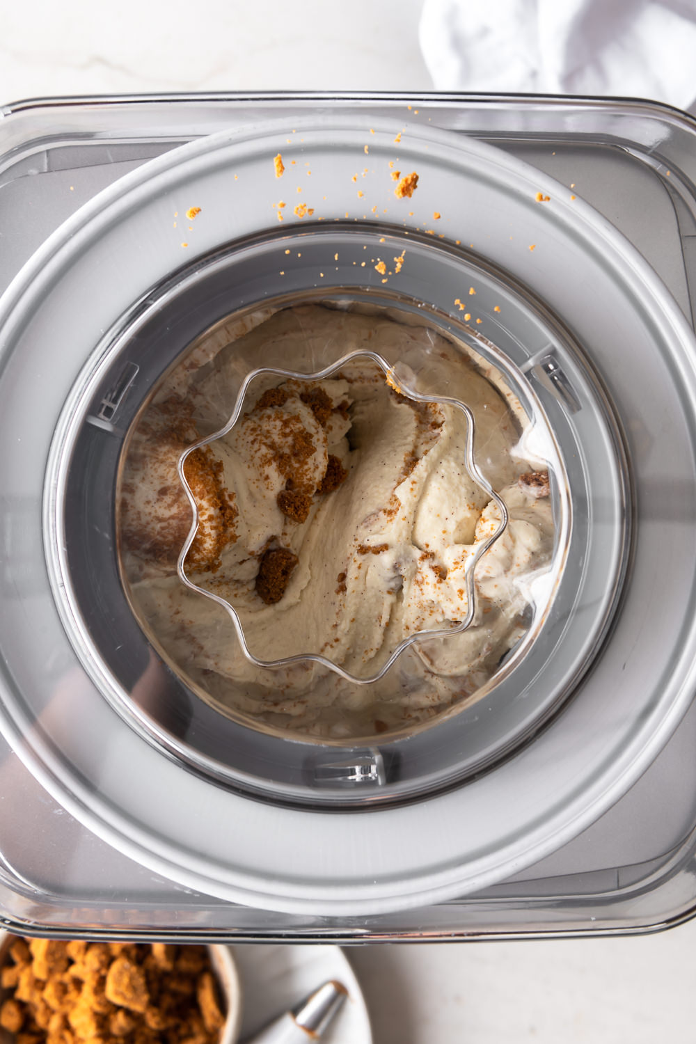 churning biscoff ice cream in machine