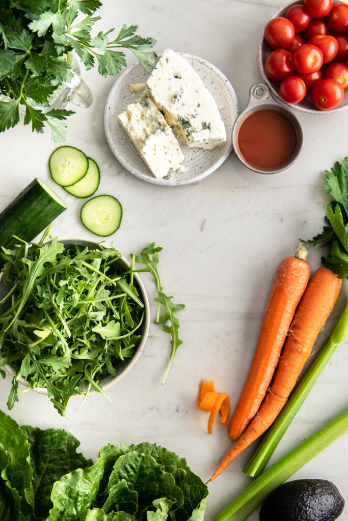 romaine, arugula, parsley, carrots, celery, tomatoes, blue cheese, chicken