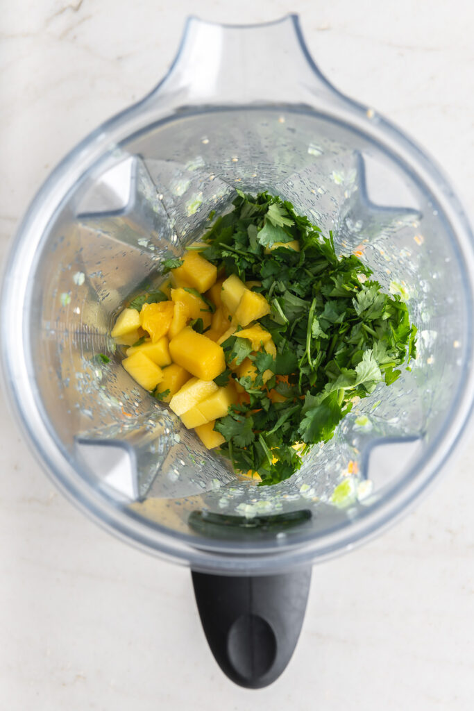 blending mangos and cilantro